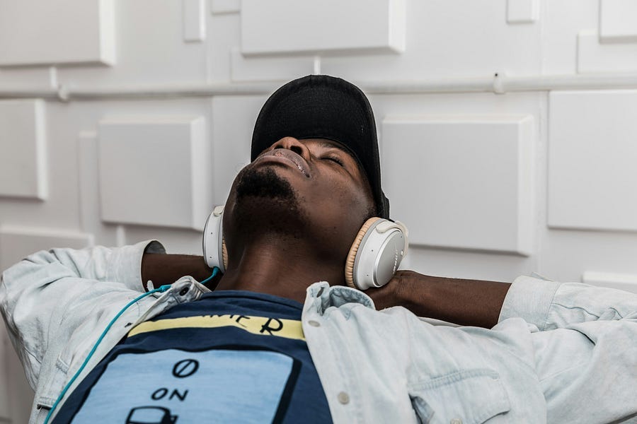 man with headphones resting and sleeping. man with headphones resting and sleeping.