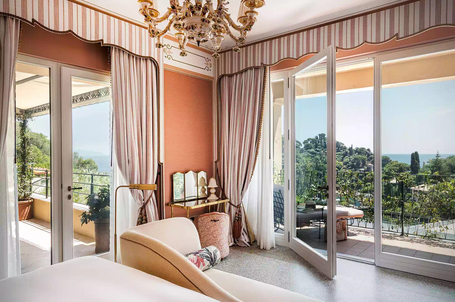 Luxurious hotel room with a terrace offering a scenic outdoor view