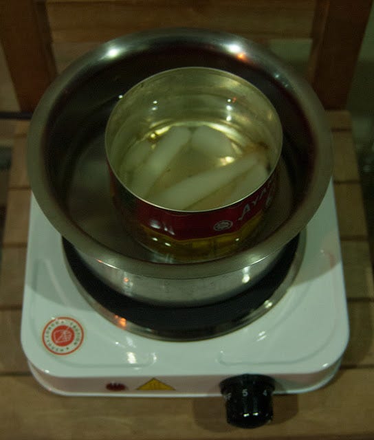 Double boiler to melt paraffin wax and turpentine 