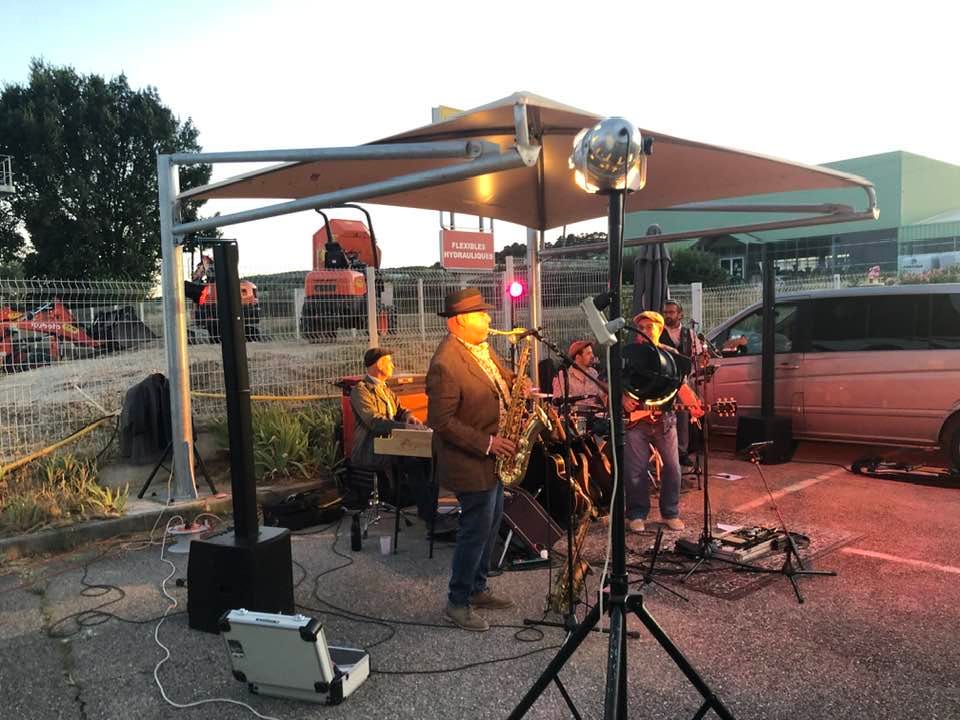 May be an image of 5 people, speaker, saxophone, lighting and accordion