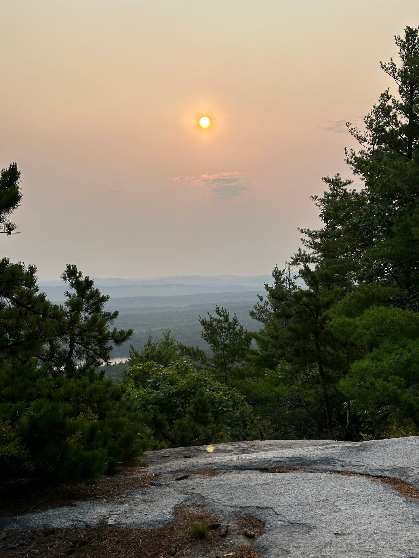 A morning sunrise on the peak of Bald Plate Mountain in Maine.