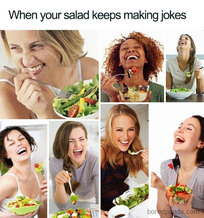 Women eating salad and laughing hardily