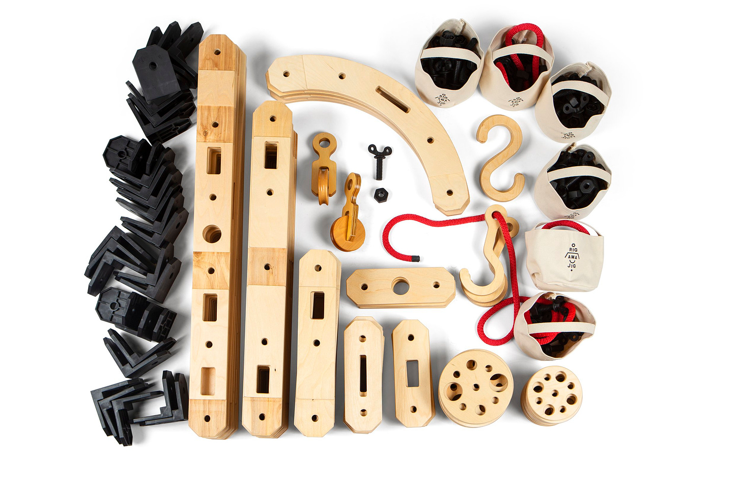 The kit of parts in Rigamajig, gathered in one clean collection: wooden slats with multiple holes for fastening, corner joists, pulleys, hooks, cords, and gears.