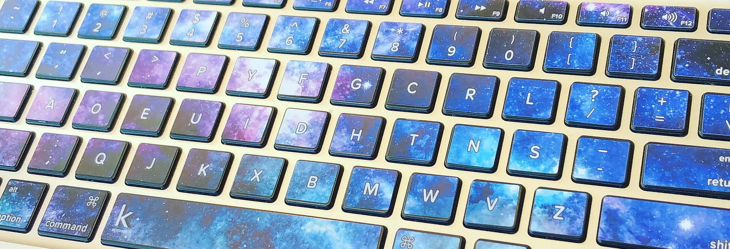A keyboard with galaxy-themed keys