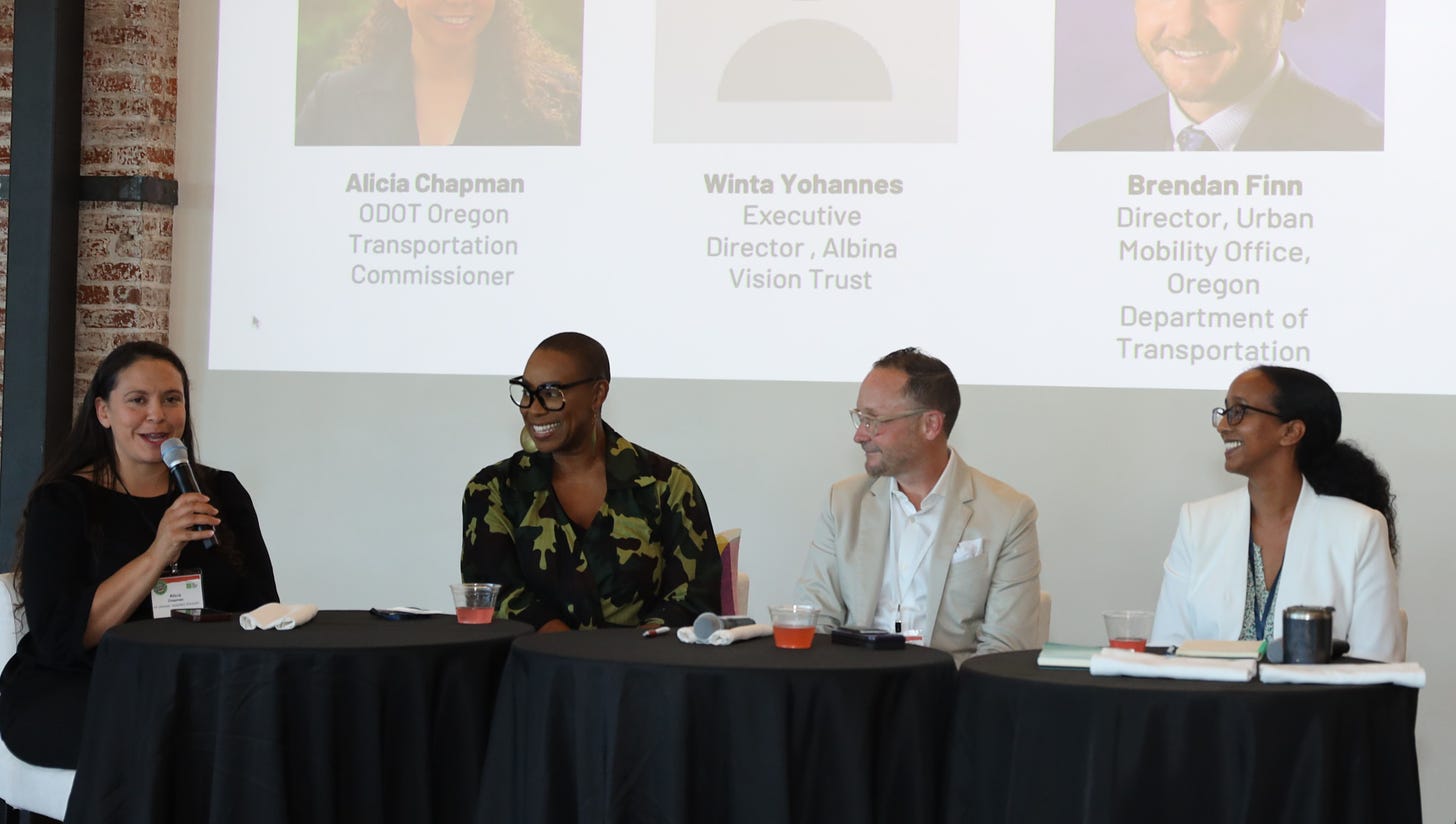 Oregon Transportation Commissioner Alicia Chapman moderates a panel on the Albina Vision flanked by Ericka Warren (Historic Albina Advisory Board), Brendan Finn (Oregon Department of Transportation), and Winta Yohannes (Albina Vision Trust)