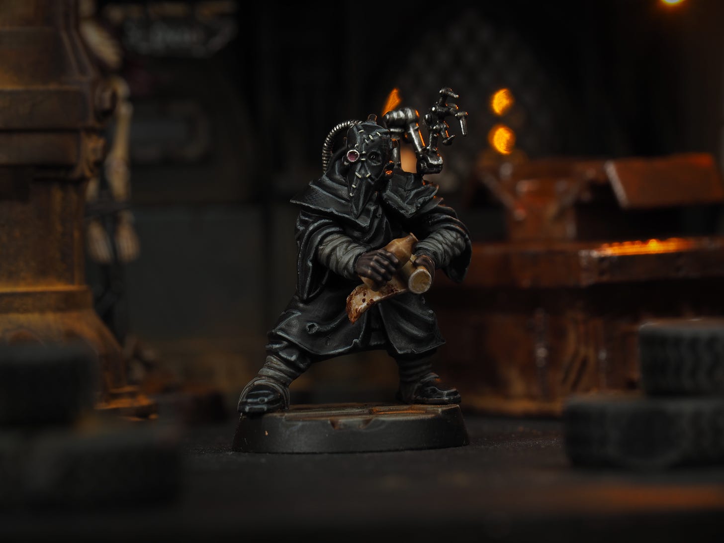 a rogue doctor of Necromunda clad in all black robes, clutching medicine bottles