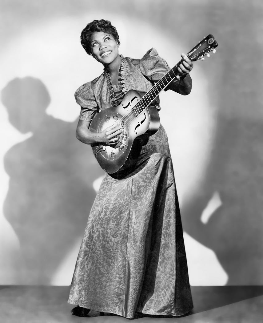 Publicity photo of musician Sister Rosetta Tharpe posed with a guitar in 1938.