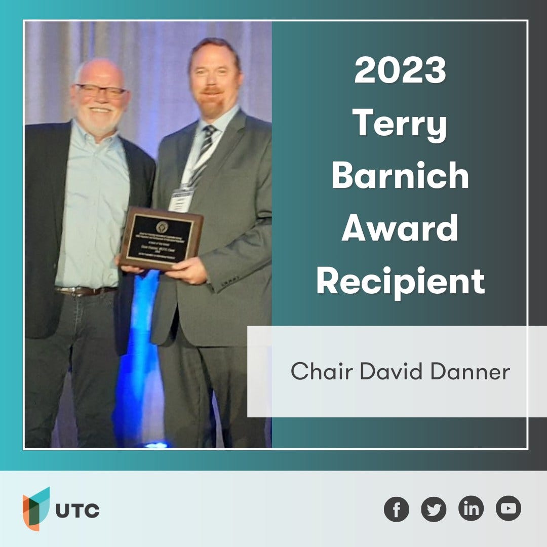 UTC Chair David Danner received the Barnich Award plaque from NARUC Executive Director Greg White.