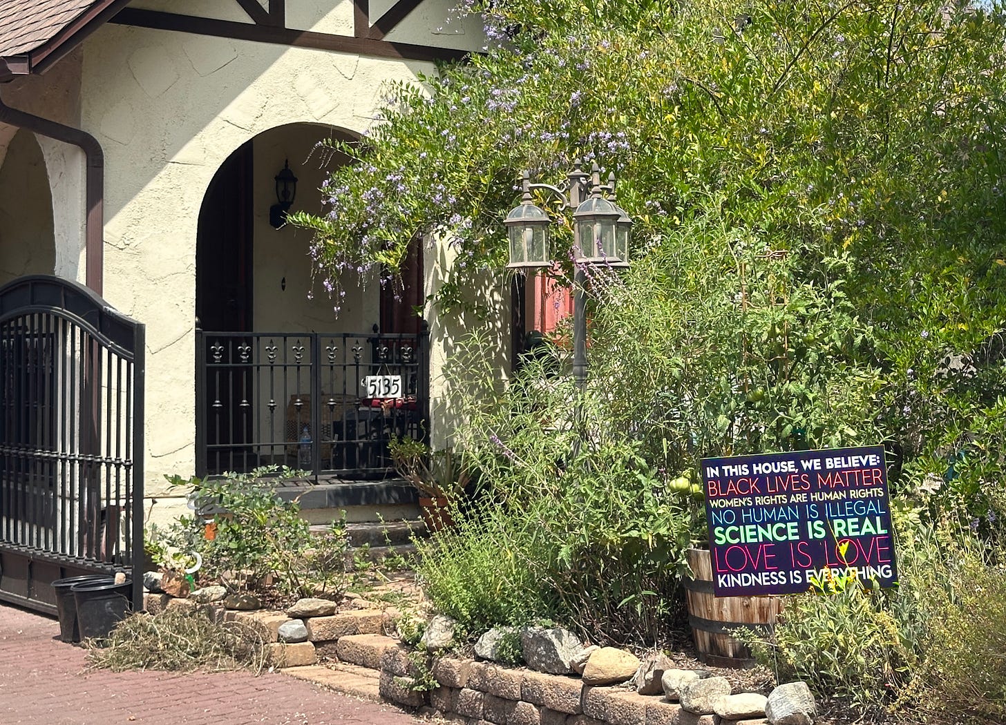 One of those cheesy "In this house we believe..." signs