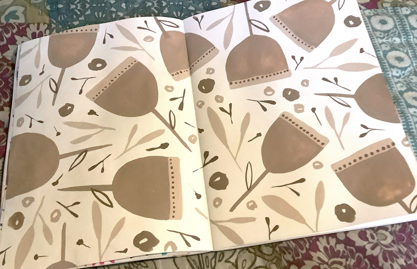 sketchbook spread showing painted floral pattern in beige and cream colours - painted by Tasha Goddard