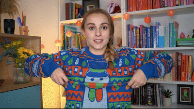 Hannah slowly lifting up her Yogscast Christmas jumper to reveal that the snowman has a carrot nose