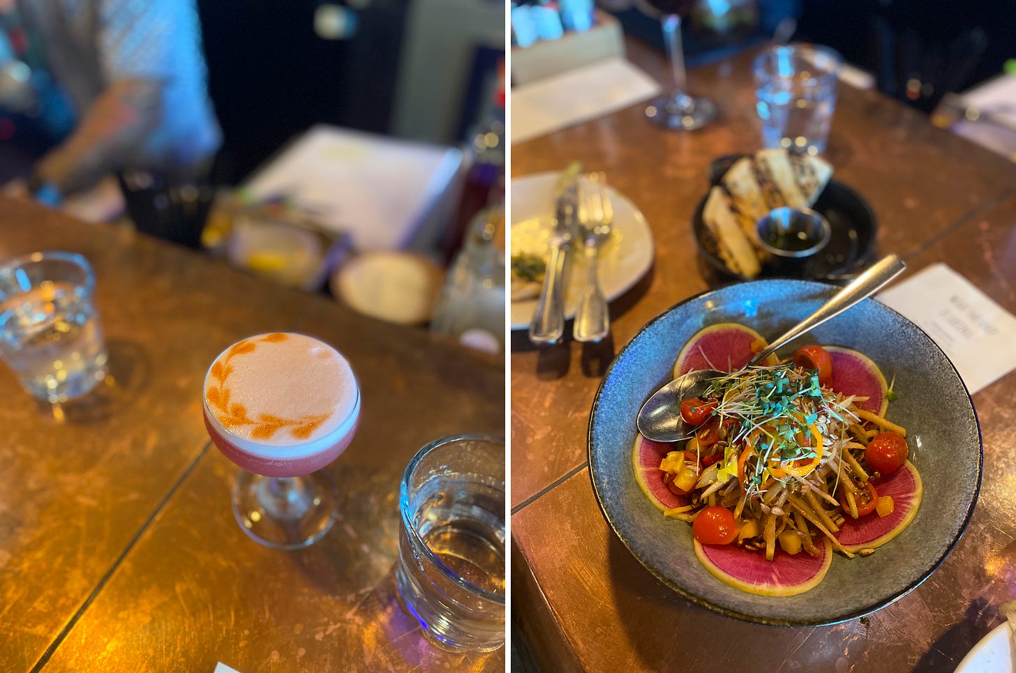 left image: a cocktail in a coupé glass, pinkish with an egg white foam on top and a heart design in bitters around the left edge. right image: the papaya and mango salad mentioned above, with grape tomatoes, hot peppers, and microgreens, on slices of watermelon radish at the bottom. It's in a blue and black ceramic bowl with a serving spoon at the back.