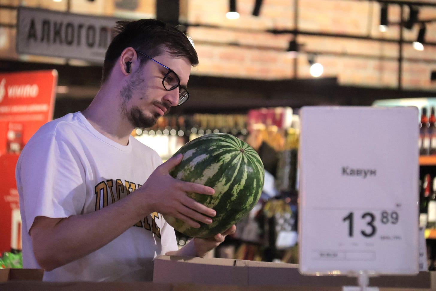 May be an image of 1 person, watermelon and text