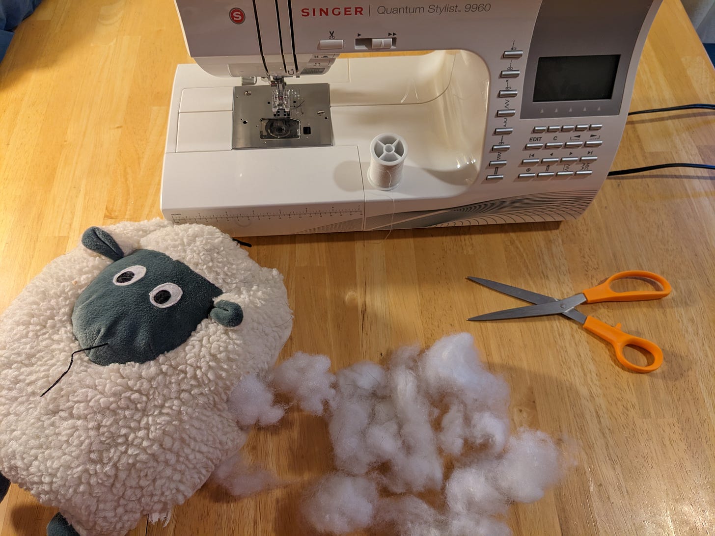 Toy needing stitching at sewing machine