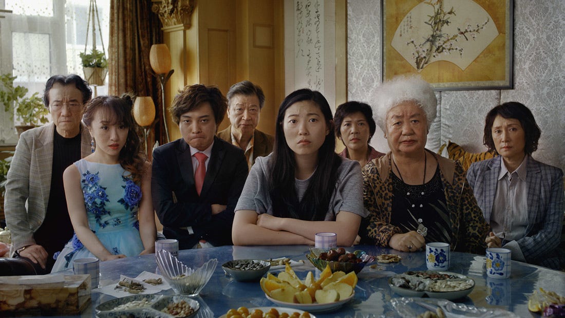 The family around a traditional Chinese dining table.