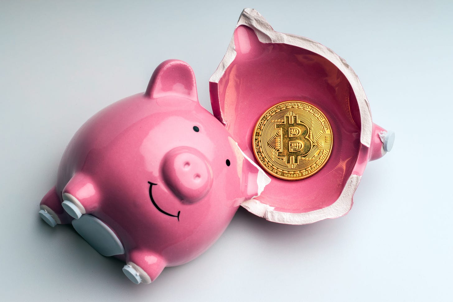 Bitcoin,In,Fragments,Of,A,Broken,Piggy,Bank