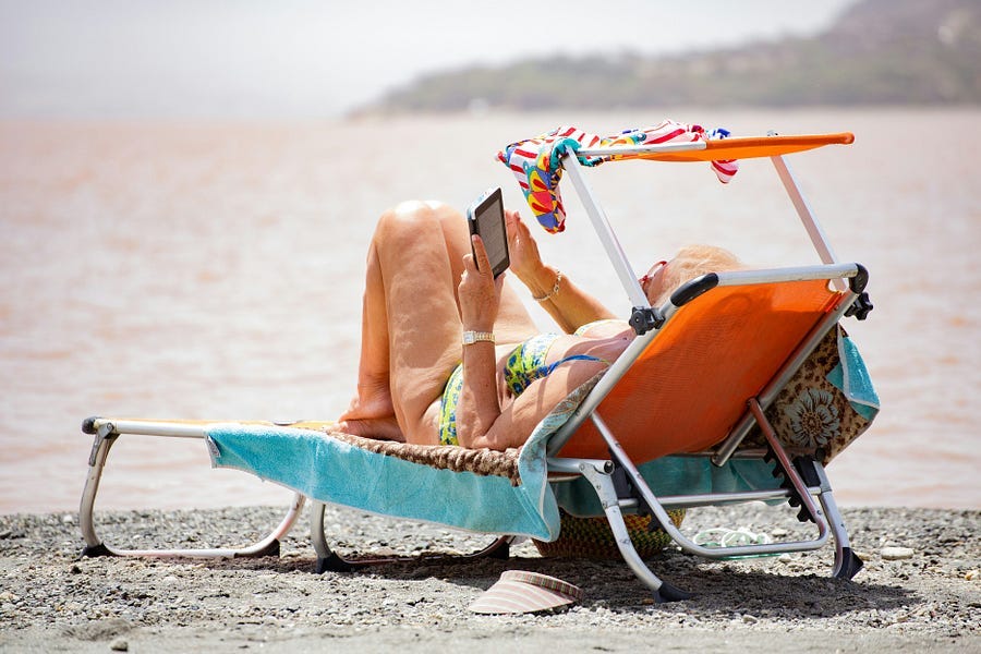 Woman relaxing on hte beach. Woman relaxing on hte beach.