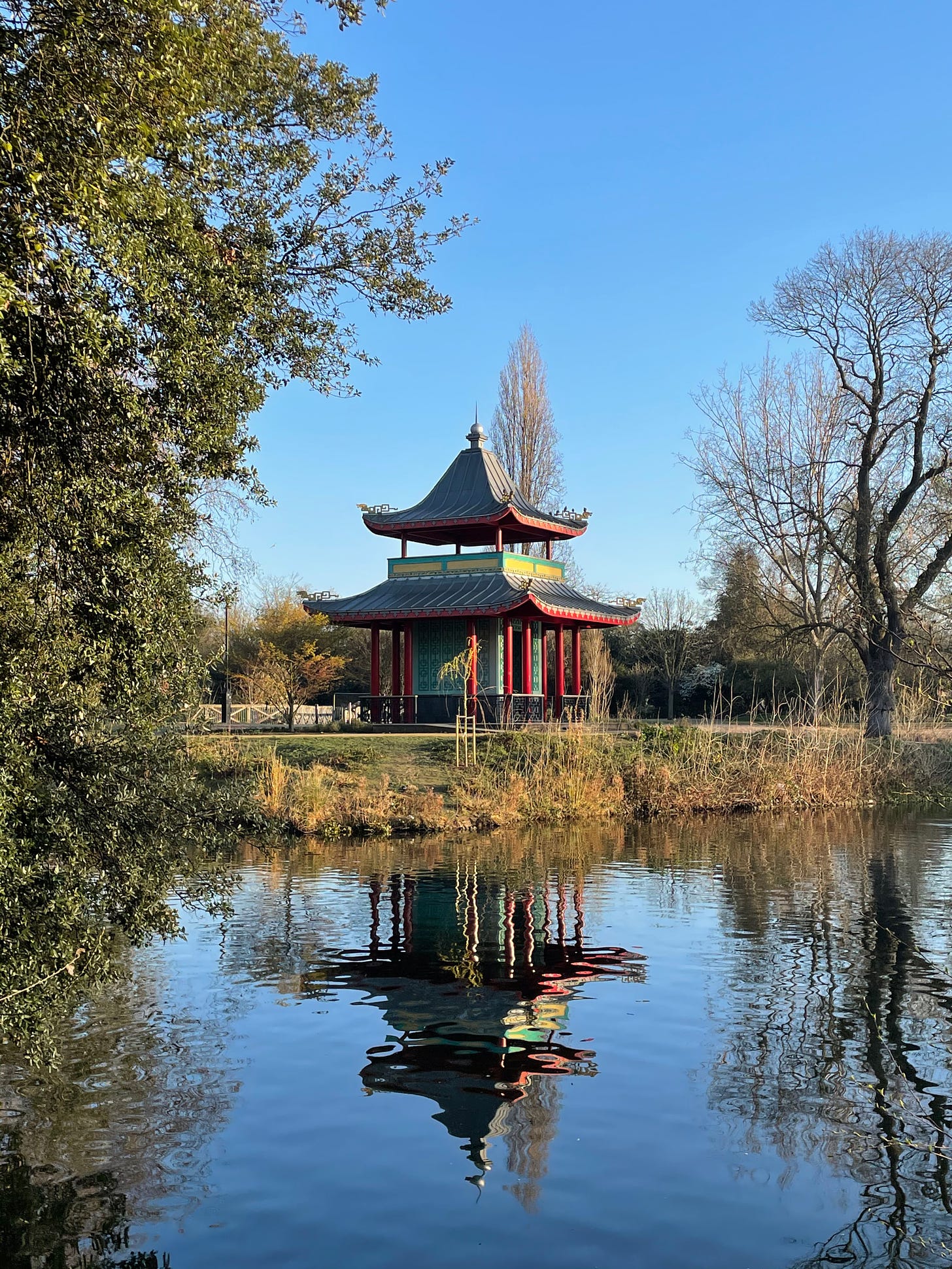 The Chinese Pagoda, Victoria Park, east London reflected in the water