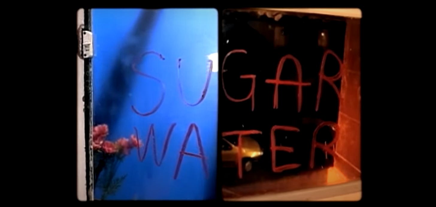 A split screen effect shows half of two windows: the left half has blue lighting, and the right half has red lighting. The left half shows the letters S-U above the letters W-A; the right half shows the remaining letters G-A-R above the letters T-E-R.