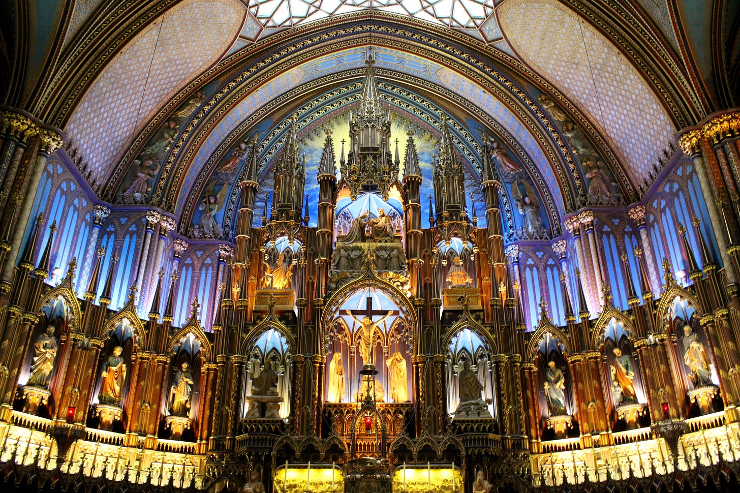 The interior of Notre-Dame Basilica, Montreal. Imagine the grandest church possible, bathed in gold and blue light.