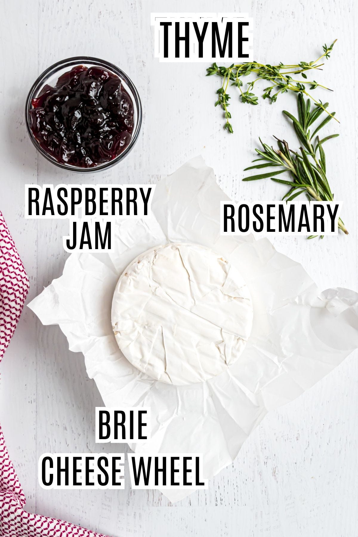 The ingredients needed to make the baked brie appetizer include a brie cheese wheel, raspberry jam, and fresh thyme and rosemary.