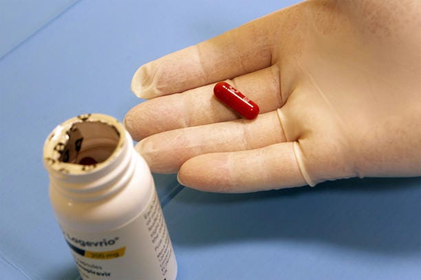 BARI, ITALY - JANUARY 11: Doctor holds in her hands the Lagevrio pill, Molnupiravir indicator for the treatment of Covid 19 on January 11, 2022 in Bari, Italy. The European Medicines Agency (EMA) announced in a press release published on January 10, that it will examine application for marketing authorization for the antiviral pill developed by Pfizer. Both Pfizer and Merck antiviral drugs have been hailed as potentially revolutionary in the fight against Covid-19, as studies show they reduce the risk of hospitalization and death in patients at increased risk of developing a severe form of the disease. (Photo by Donato Fasano/Getty Images)