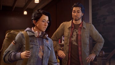 Alex, still carrying her hefty travel bag, sees Gabe's apartment for the first time. Her brother Gabe looks on, amused.