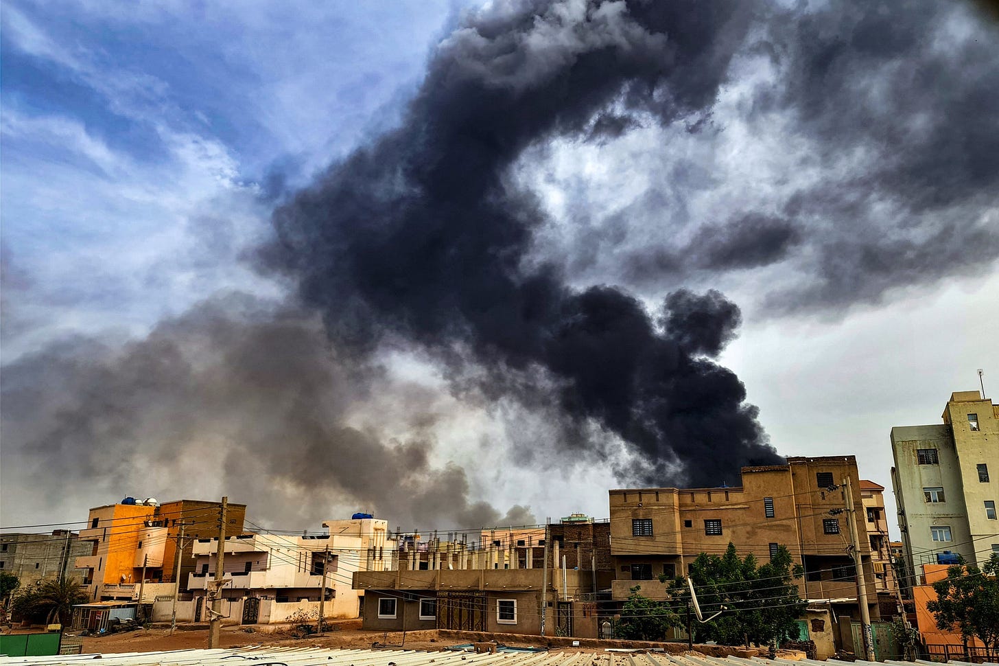 Smoke rises over Khartoum during fighting in June 2023.