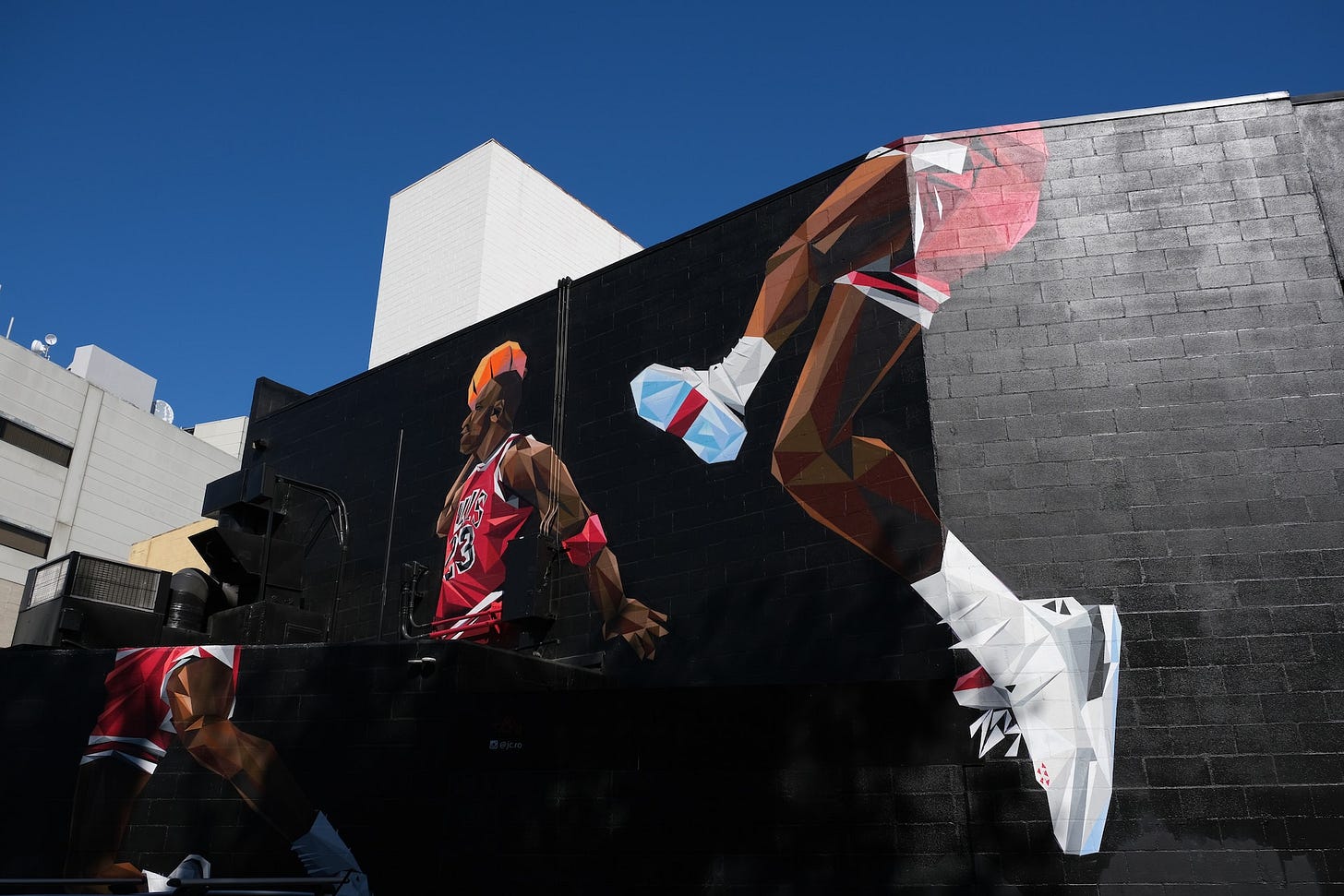 A mural of Michael Jordan dunking a basketball