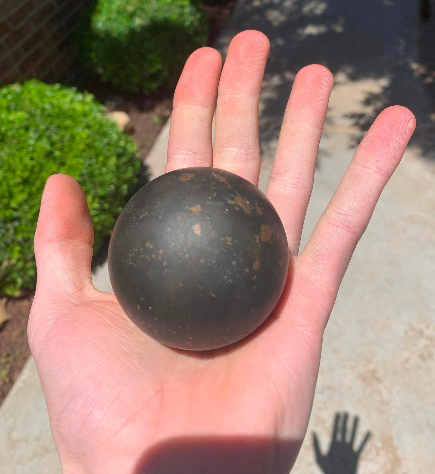I found this heavy solid metal ball in a field 5 years ago the only thing I  can think it might be is a ball bearing for some heavy machinery :  r/whatisthisthing