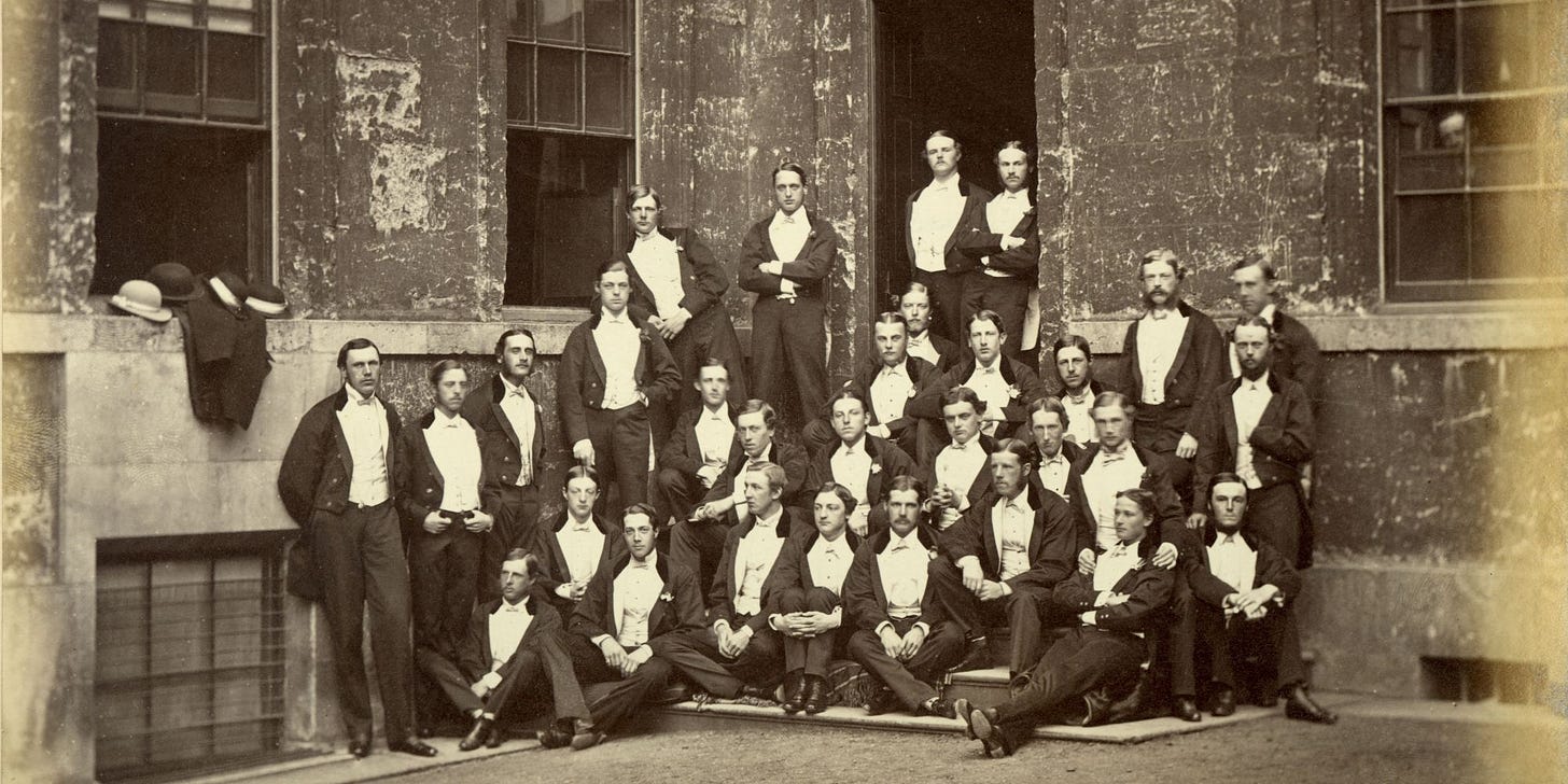 Late 1800s photo of Oxford University's Bullingdon club, a group of upper class white men pose in white tie suits on a staircase.