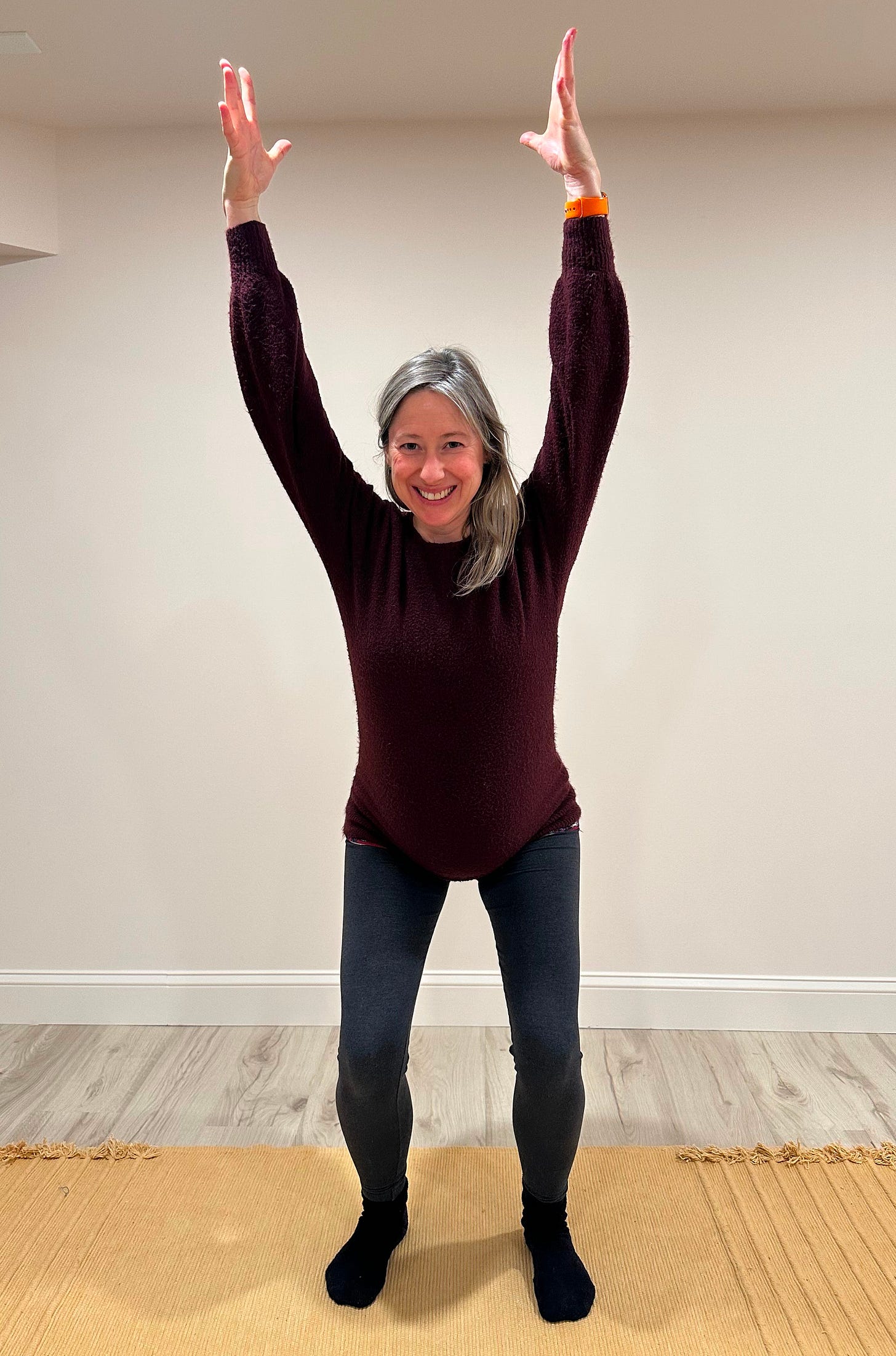 Woman squatting in Firebolt Pose