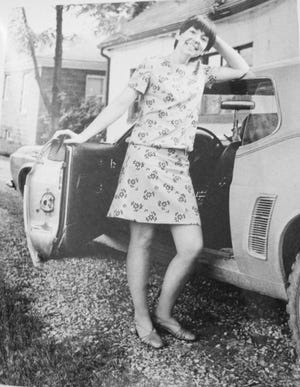 Betty Ray, mother of Ford designer Kristen Keenan, stands with her 1969 Ford Mustang in Dearborn in 1970.