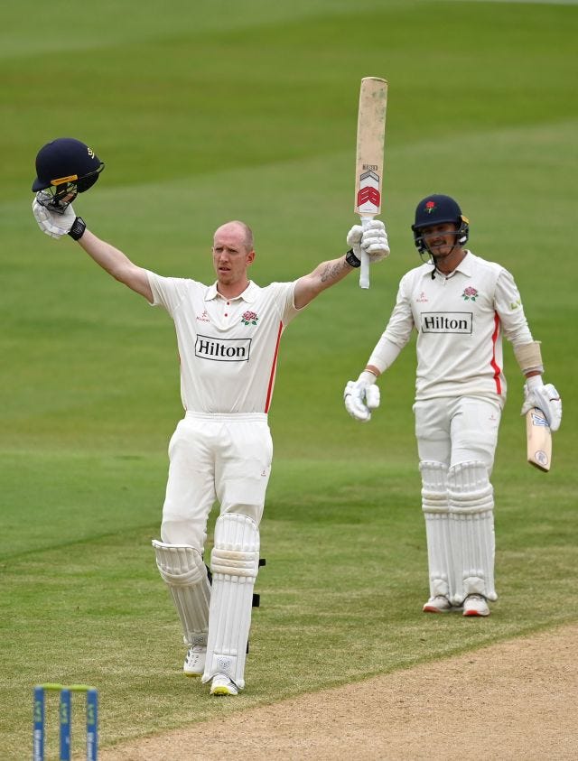 Luke Wells celebrates reaching his century