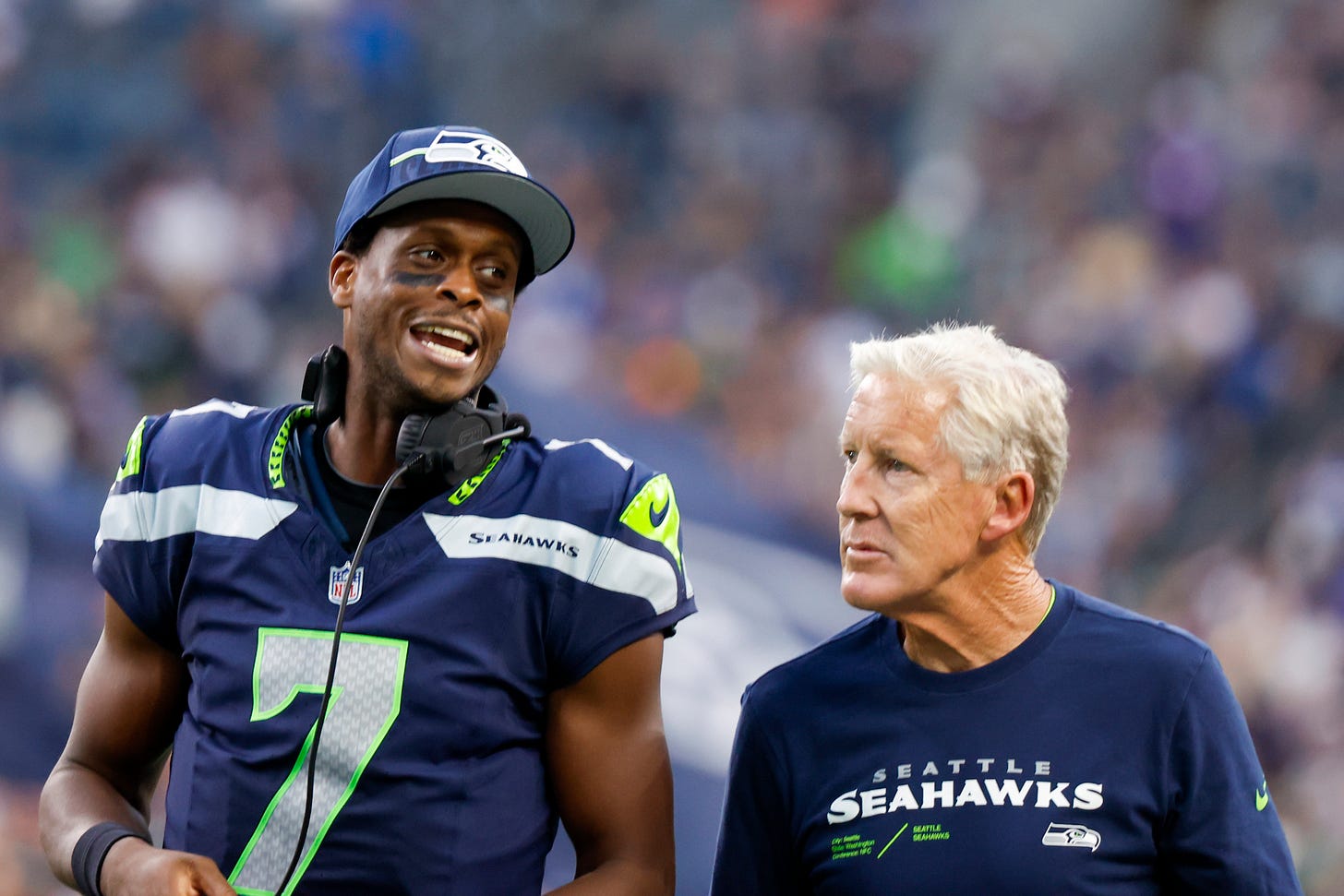 Aug 19, 2023; Seattle, Washington, USA; Seattle Seahawks quarterback Geno Smith (7) talks with head coach Pete Carroll during the second quarter against the Dallas Cowboys at Lumen Field. 
