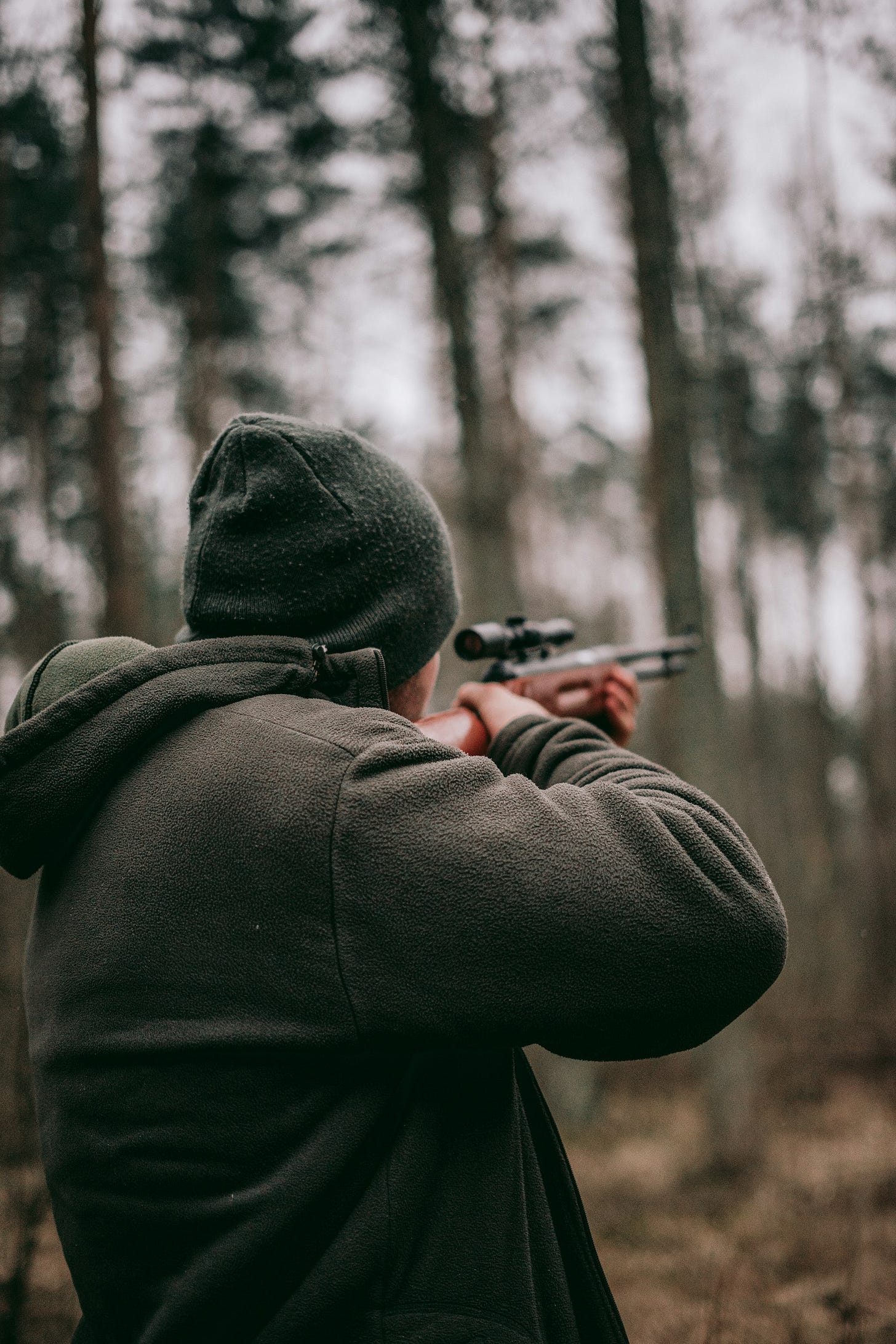 man using sniper rifle