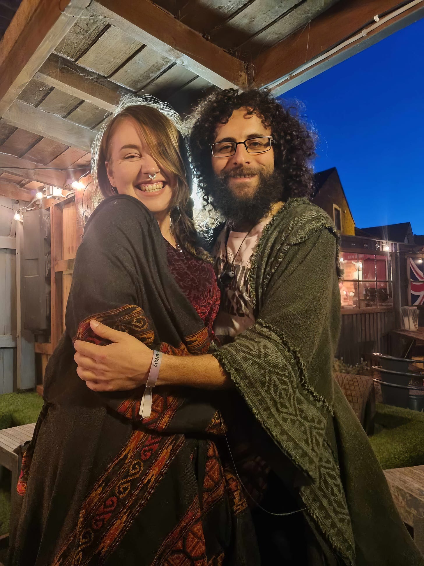 Gorgeous Georgie and Ghandi hugging tightly in pub where they met two years prior. The pub is The Vault in Ellesmere, Shropshire, England, United Kingdom.