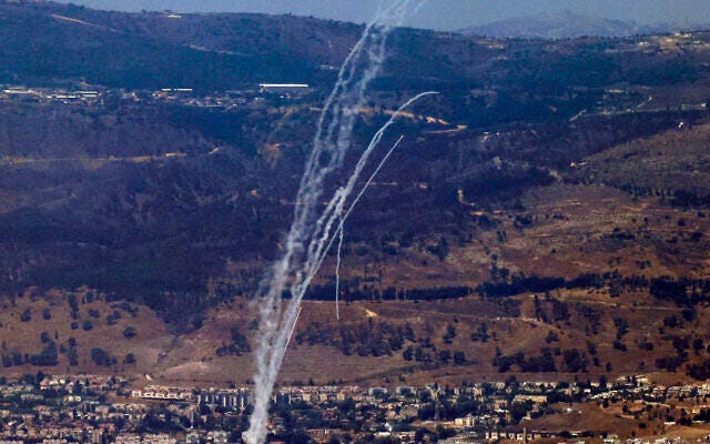 Rockets fired from southern Lebanon are intercepted by Israel's Iron Dome air defense system over the Upper Galilee region in northern Israel on August 9, 2024. (Jalaa Marey/AFP)