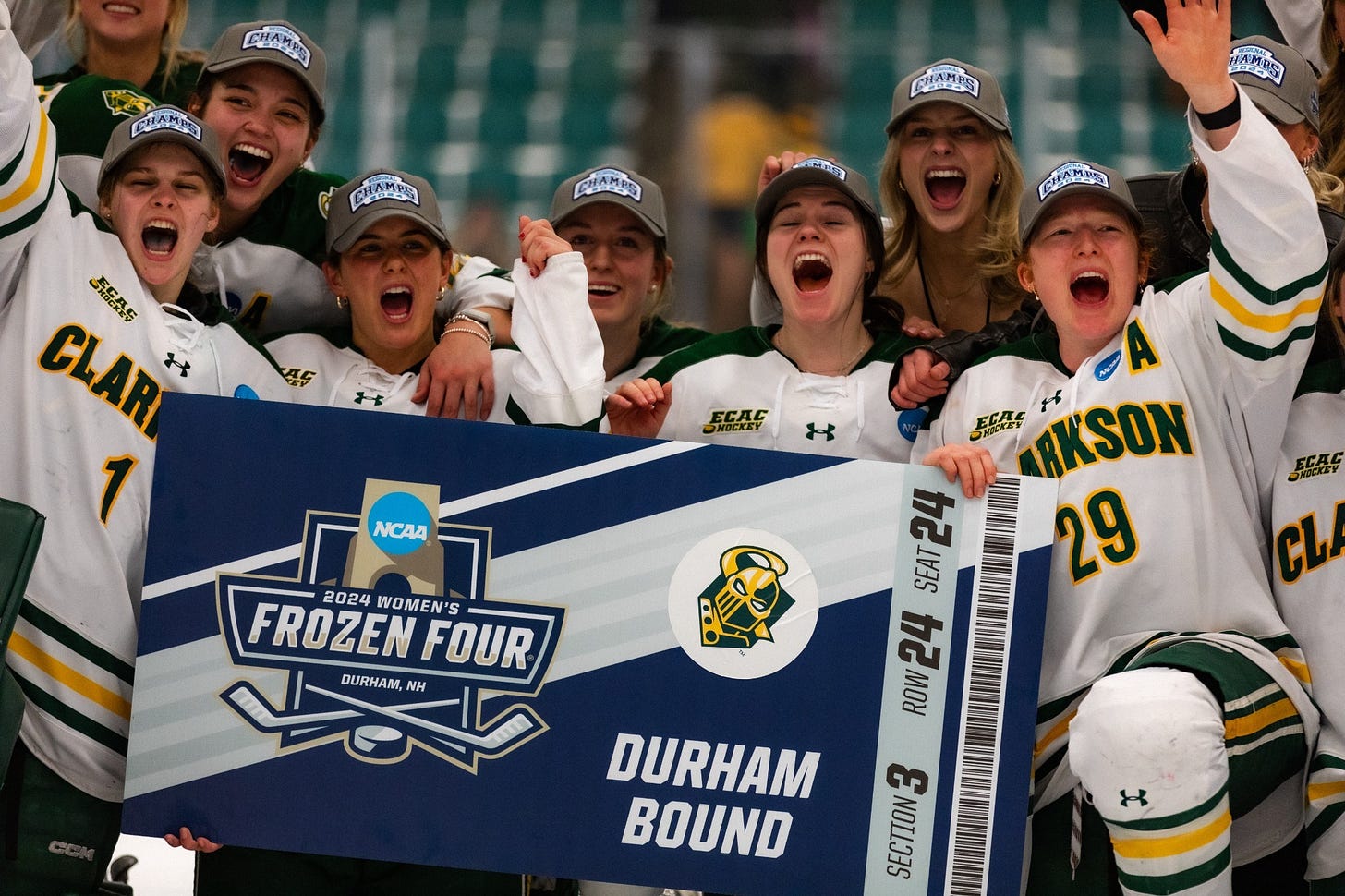Clarkson women's ice hockey players celebrating after defeating Minnesota, posing with a giant ticket for the Frozen Four.