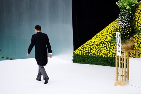 Japan's Prime Minister, Fumio Kishida, walks off stage after he attends a memorial service ceremony marking the 79th anniversary of Japan's surrender in World War Two, at Budokan Hall in Tokyo, August 15, 2024