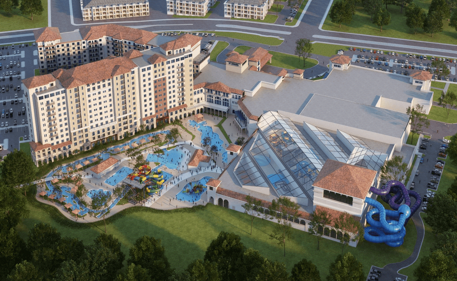A aerial rendering of an indoor/outdoor waterpark next to a 12-story hotel
