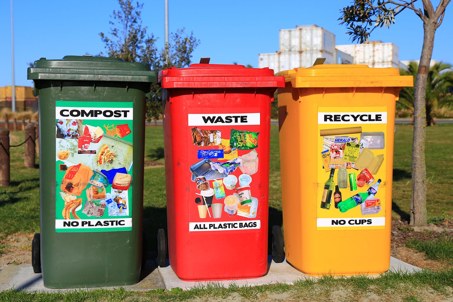 Green, red an yellow waste bins