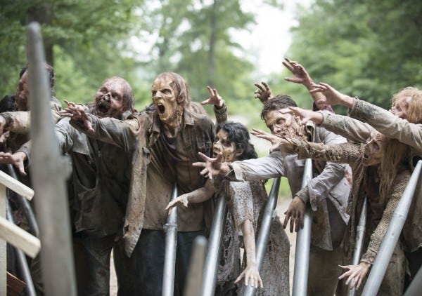 walking dead zombie walkers attacking gabriels church