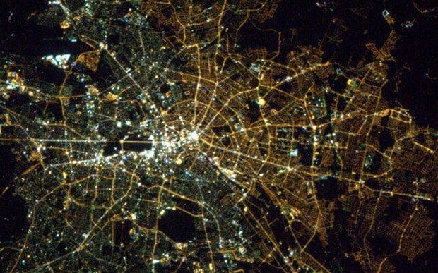 The image from space highlights the higher levels of commercial activity in the west, over two decades after the fall of the Wall. 