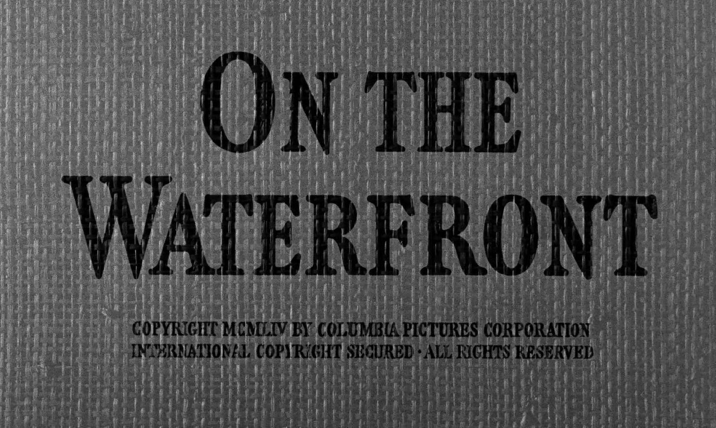 The opening credits from the 1954 film On the Waterfronts, set over a burlap sack of the kind in which goods would be shipped