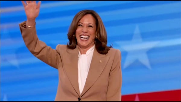 Kamala Harris is accused of 'deep cut trolling' as she wears tan suit  during surprise DNC speech in nod to Barack Obama | The US Sun