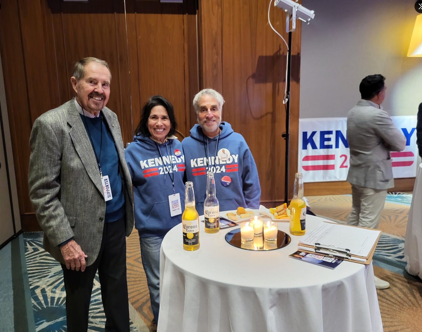 left to right, Larry Kent (suit), Dorothy Gutierrez, and Brett Applebaum