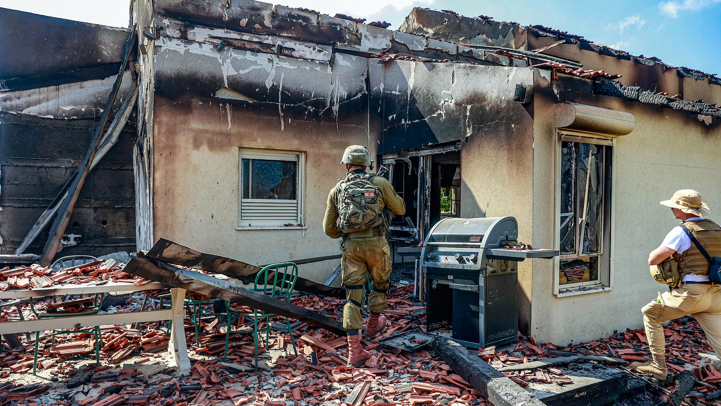 BE'ERI, ISRAEL - OCTOBER 13: Israeli forces are seen among the rubble of buildings destroyed after the clashes between Israeli and Palestinian forces in Be'eri, Israel on October 13, 2023.