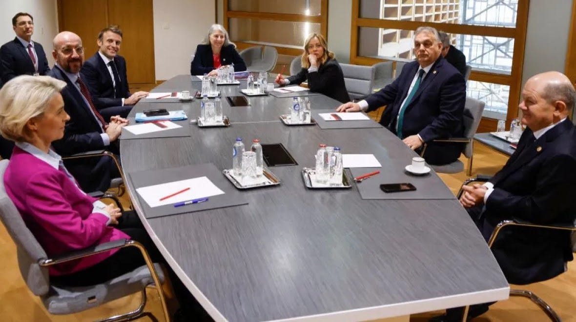 EU leaders sitting around an office meeting table.