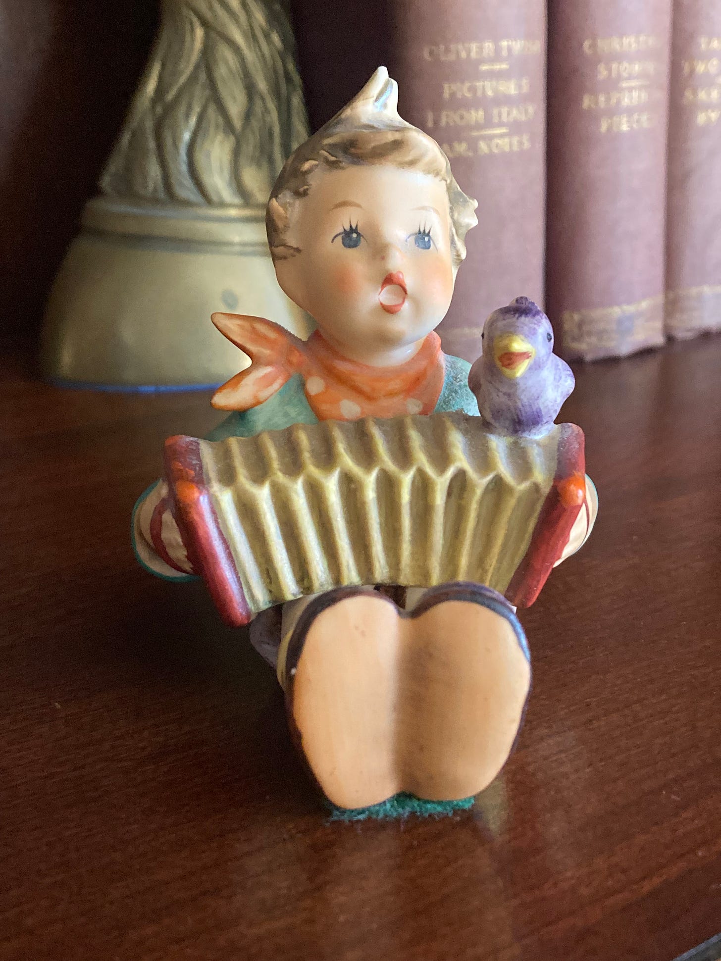 Hummel procelain figurine of a little boy playing the accordion 